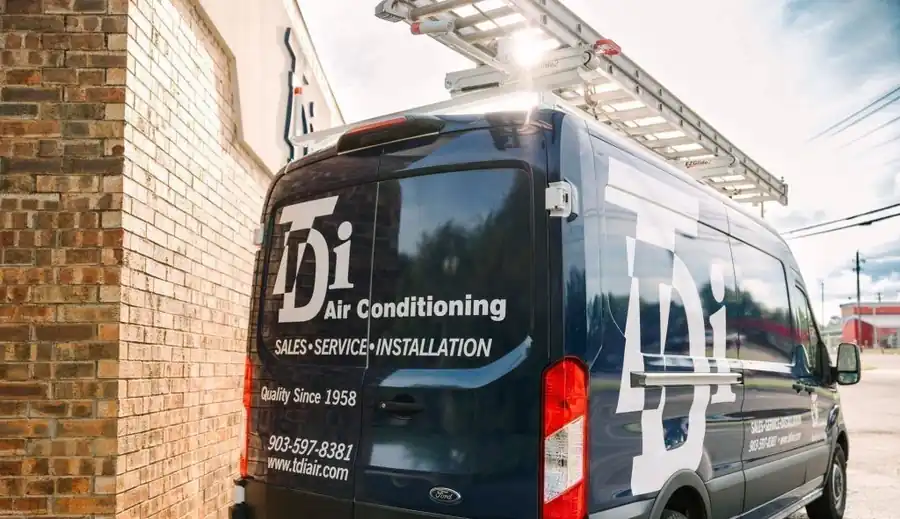 Back doors of a navy TDi van: TDi Air Conditioning, Sales Service Installation, Quality Since 1958, 903-597-8381, www.tdiair.com
