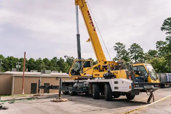 Crane setting equipment on a commercial roof